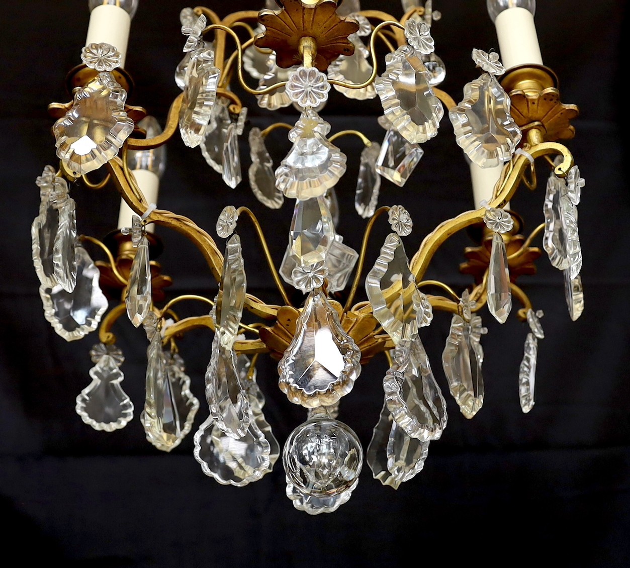 An early 20th century French gilt bronze and cut glass six light chandelier, height 54cm. width 40cm